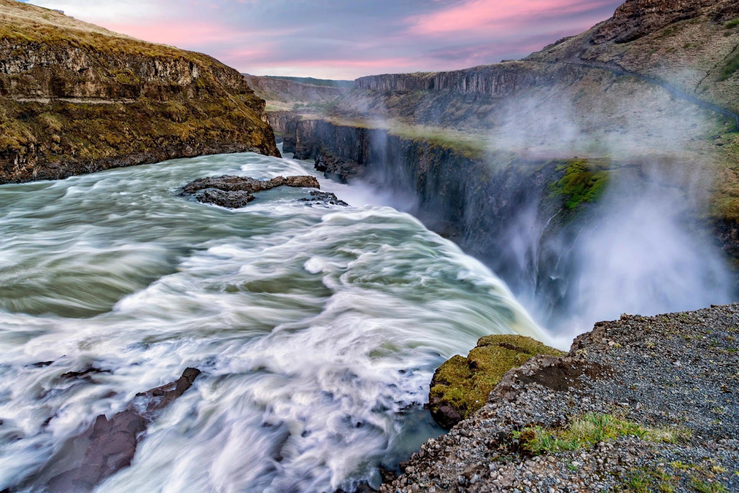 Gullfoss waterfall cutting through a dark Icelandic gorge