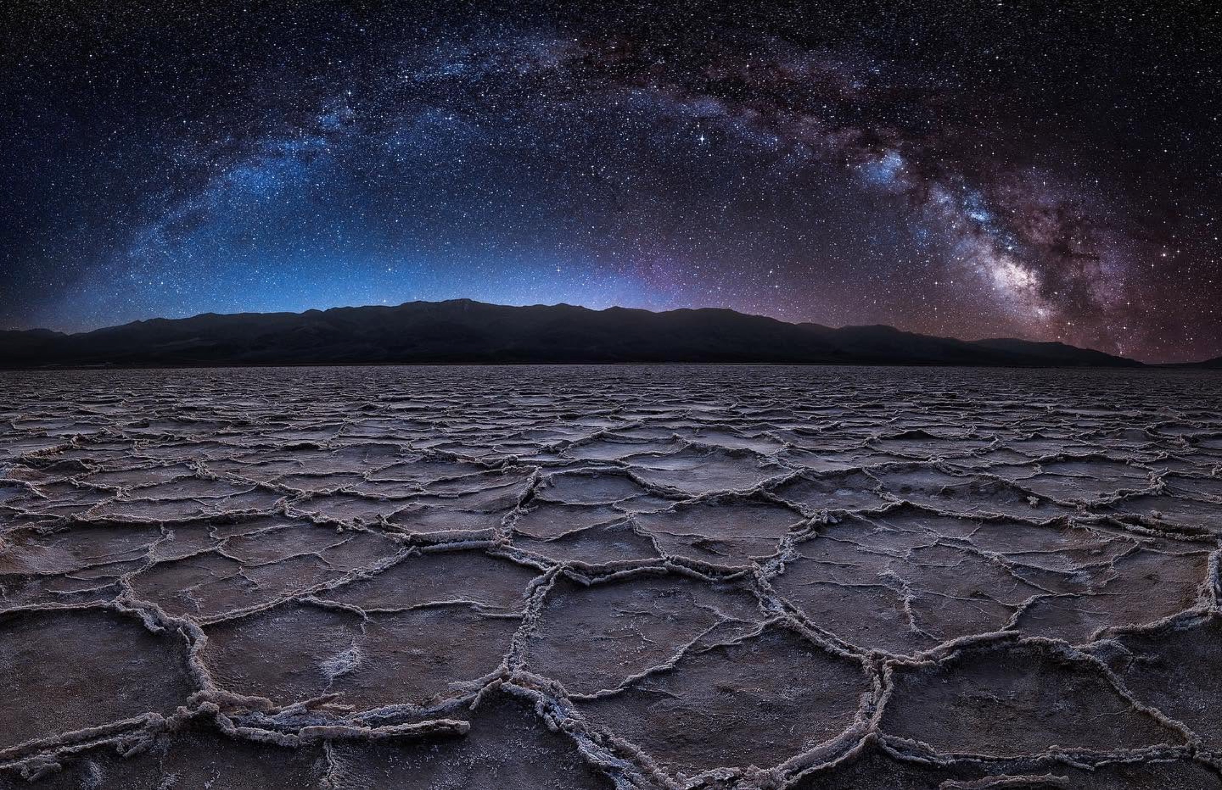 The Milky Way arching above the Death Valley salt flats